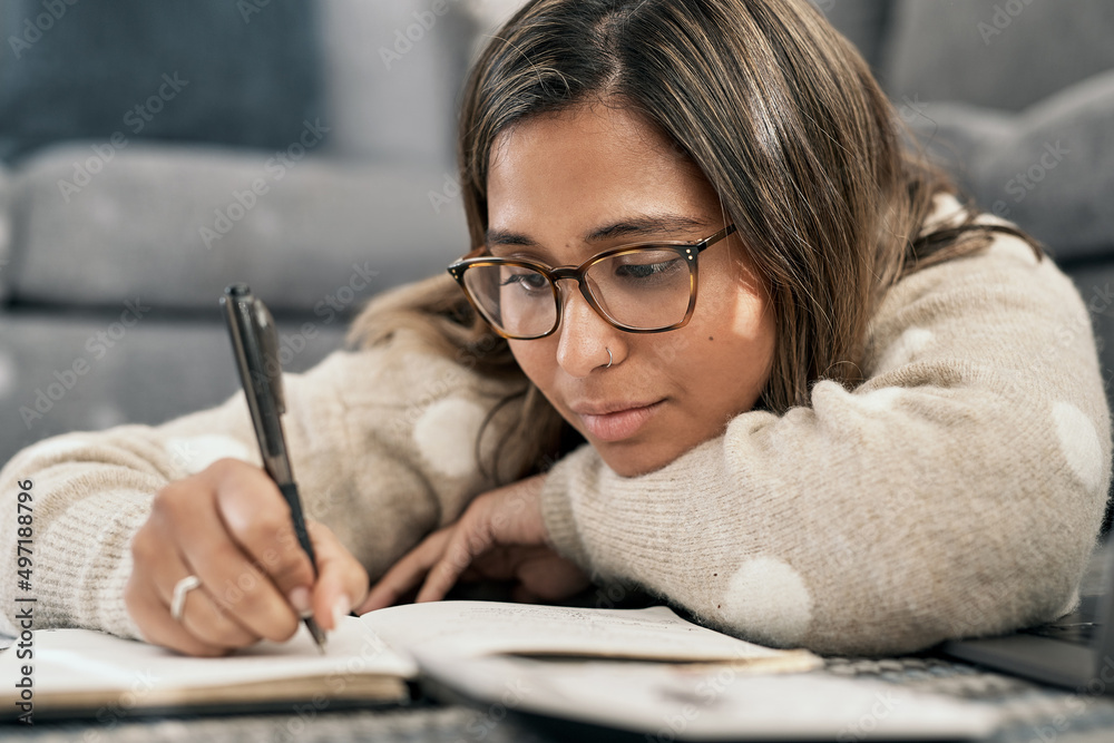 Its always a good idea to make a note of it. Cropped shot of a young woman wearing glasses while bus