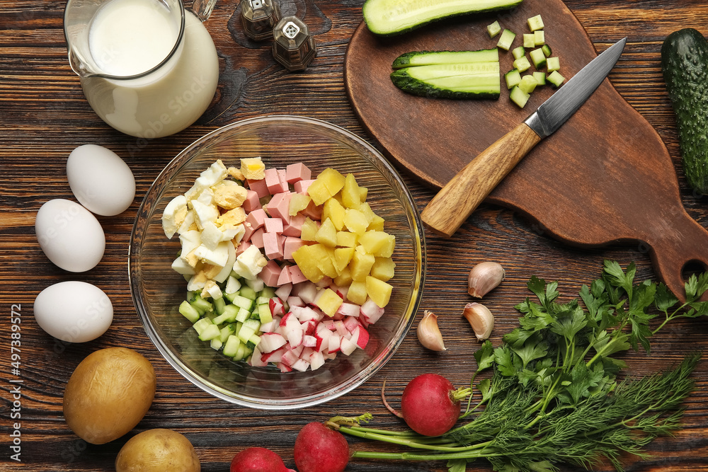 Ingredients for preparing tasty okroshka on wooden background, closeup