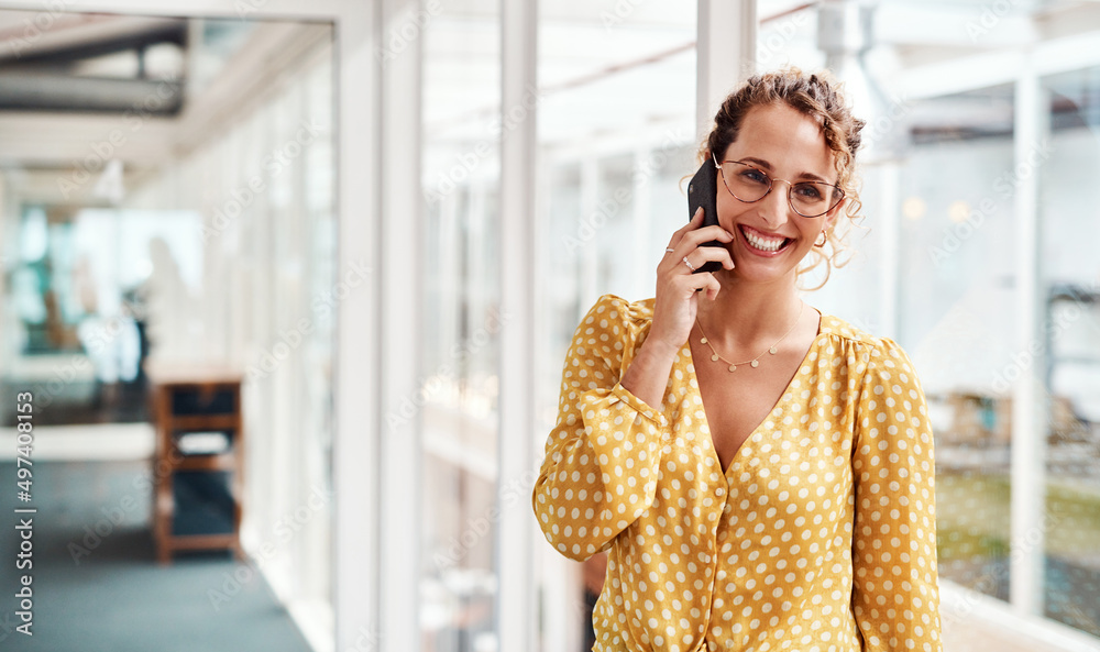 Im so glad you called. Cropped shot of an attractive young female designer making a phonecall while 