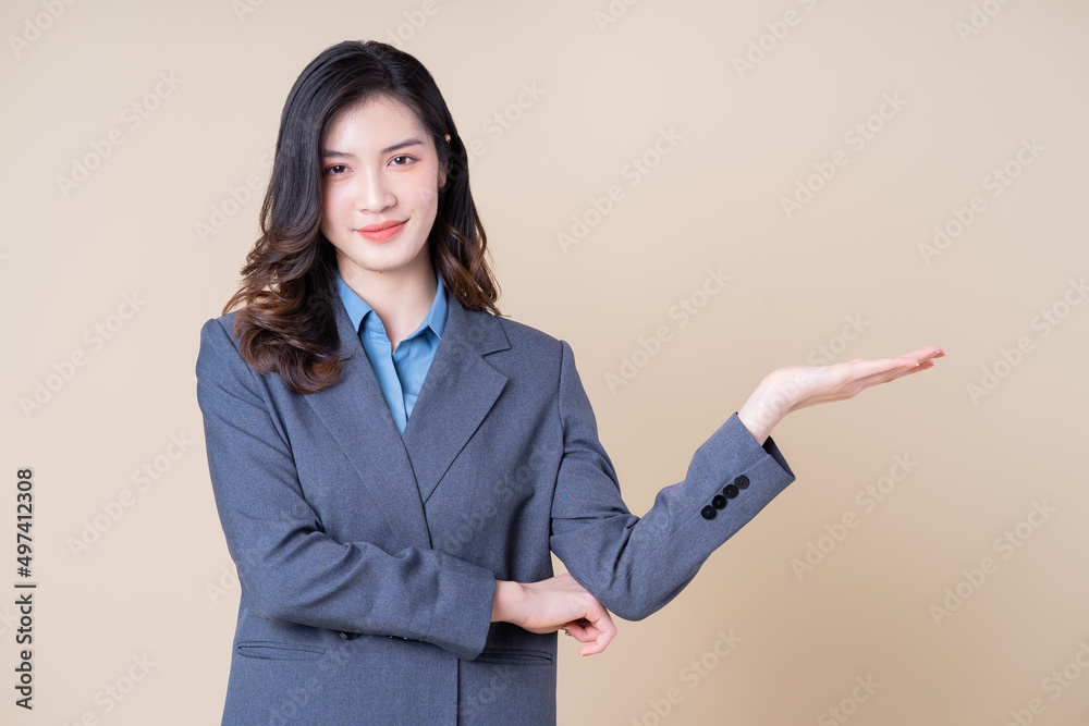 Portrait of young Asian business woman on background