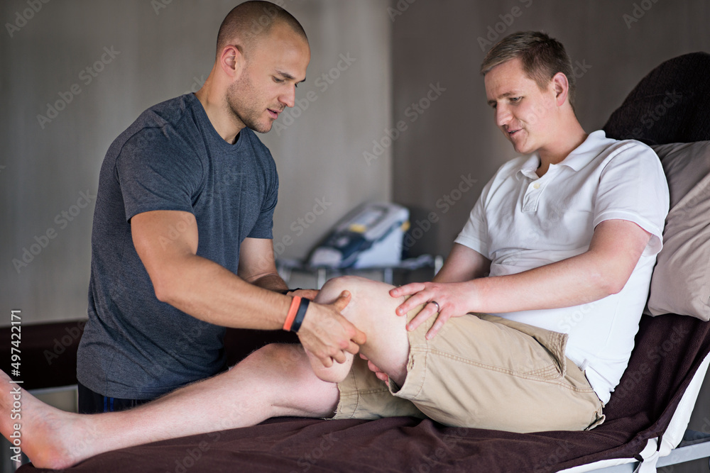 Hes an amazing physiotherapist. Shot of a physiotherapist examining a man with an amputated leg.