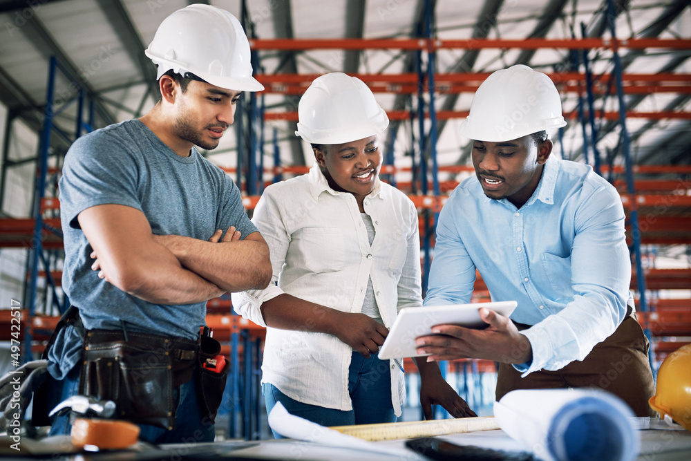 Exceptional designs from an exceptional team. Shot of a group of builders having a meeting at a cons