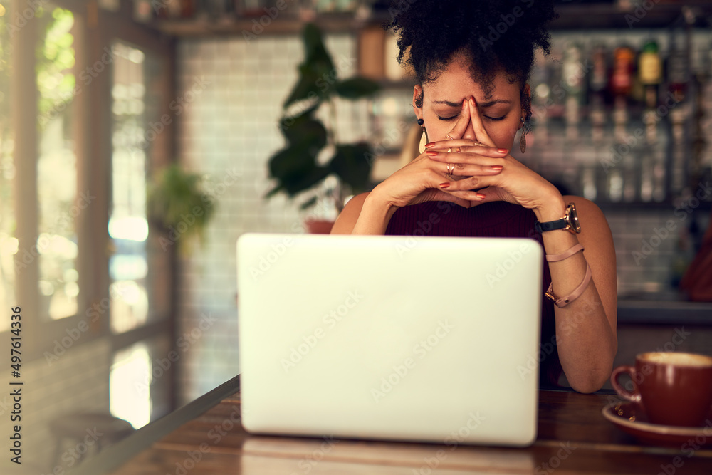 Some things just arent meant to work out. Cropped shot of a young woman looking stressed out while w