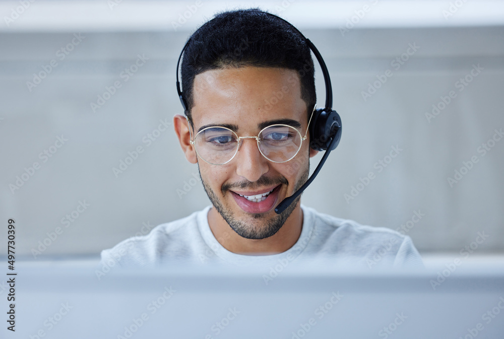 Looking forward to taking the day by the horns. Shot of a young businessman working at his desk in h