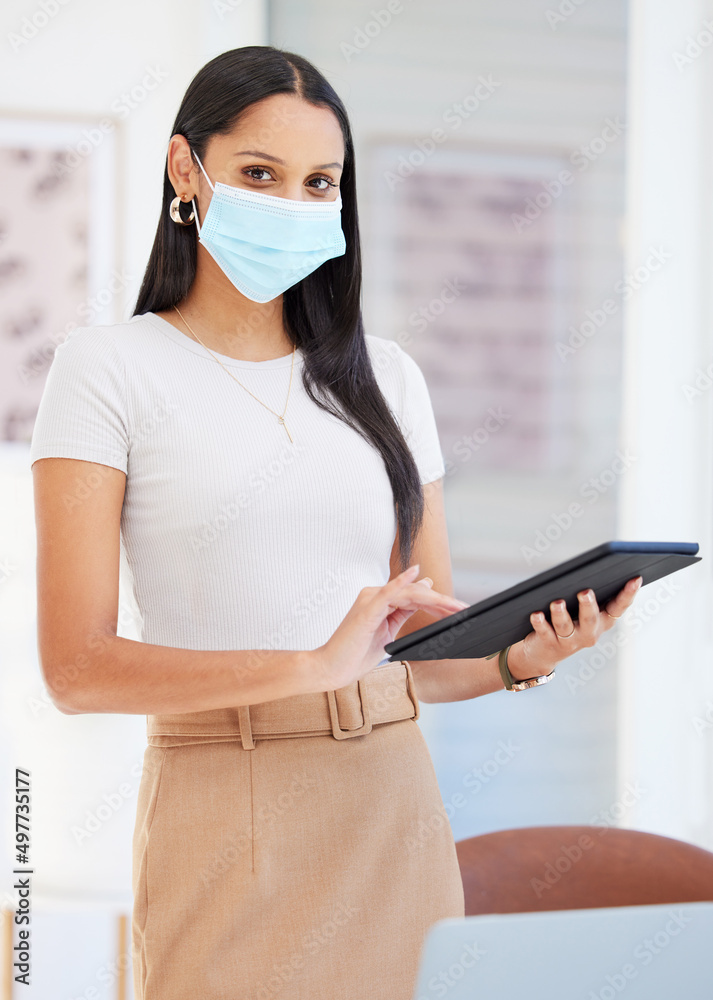 Its important to keep the workplace safe. Shot of a young businesswoman using a digital tablet in he