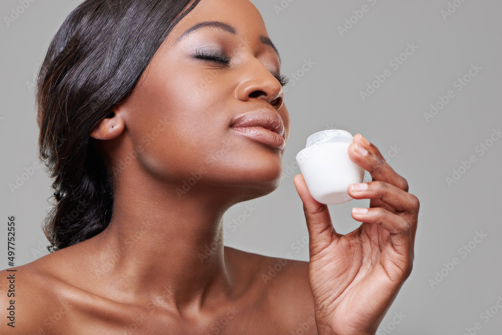 Youll be the envy of everyone with this.... Cropped studio shot of a beautiful young woman smelling 