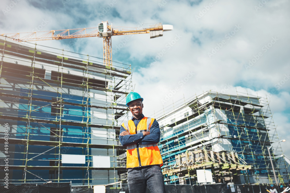 You can count on our quality of construction. Portrait of a confident young man working at a constru