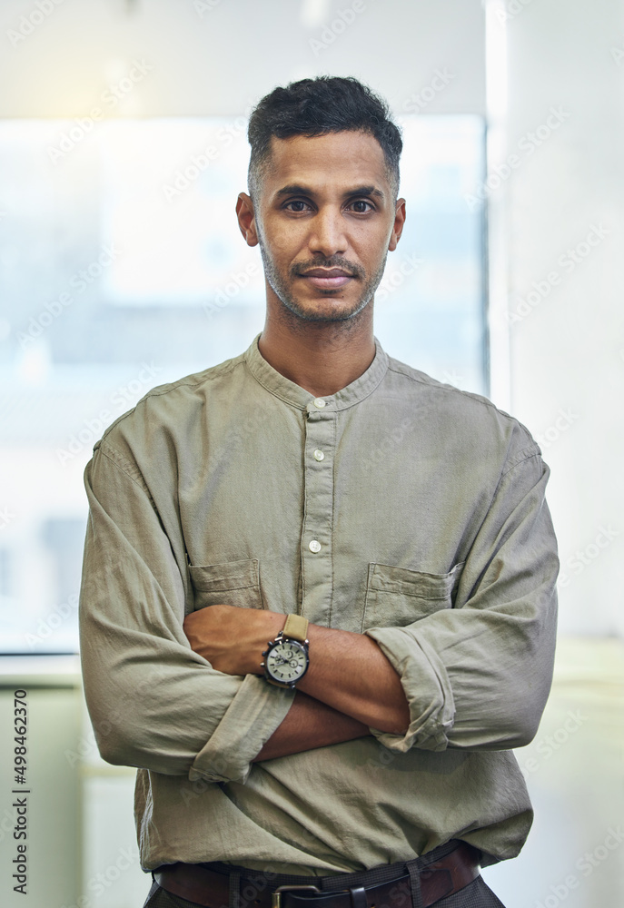 Moving forward with confidence. Cropped portrait of a handsome young businessman standing with his a