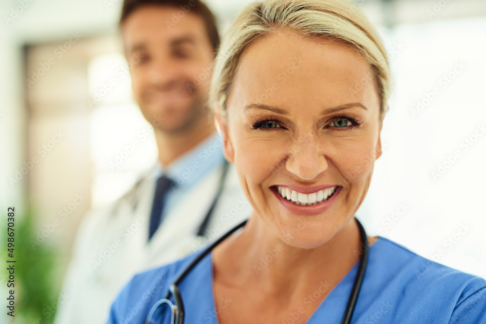 What would a doctor be without his nurse. Portrait of two happy healthcare practitioners posing toge