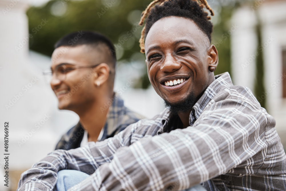 Smiling but were stressed. Shot of two young men on campus.