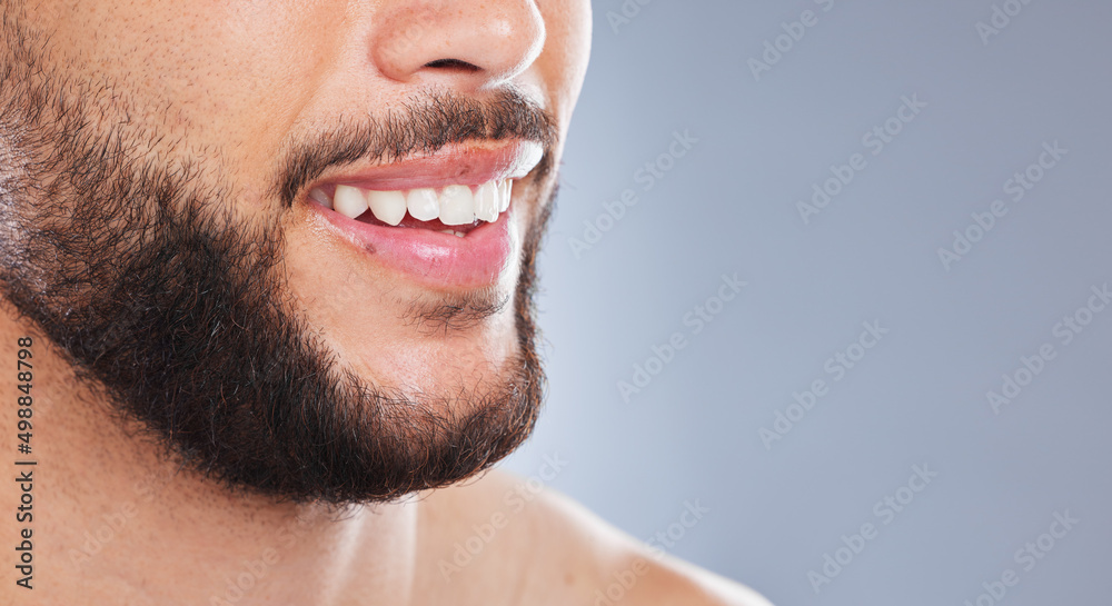 The freshest smile since forever. Cropped studio shot of an unrecognisable man smiling against a gre