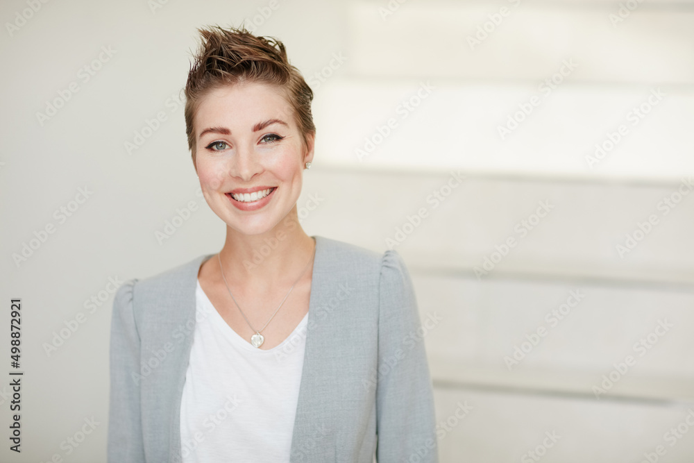 Ive taken all the right steps to success. Portrait of a young businesswoman standing in an office.