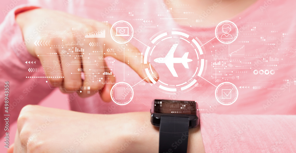 Flight ticket booking concept with woman pressing a smart watch