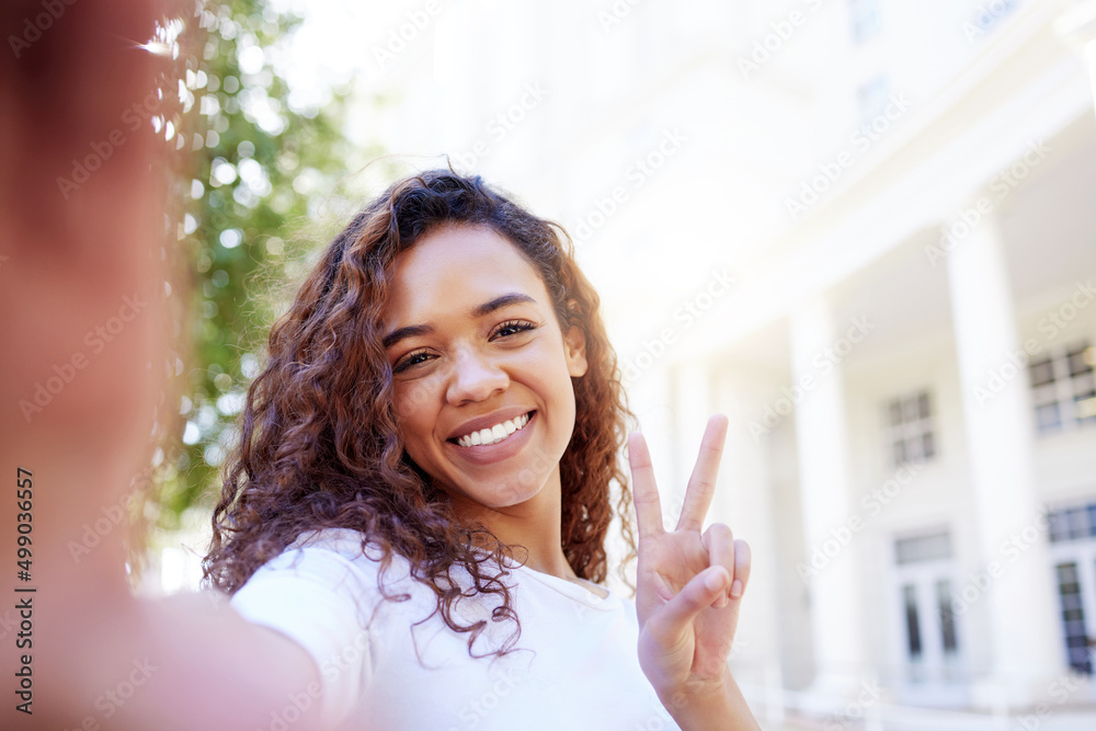 There is no path to happiness happiness is the path. Shot of a female showing a peace gesture while 