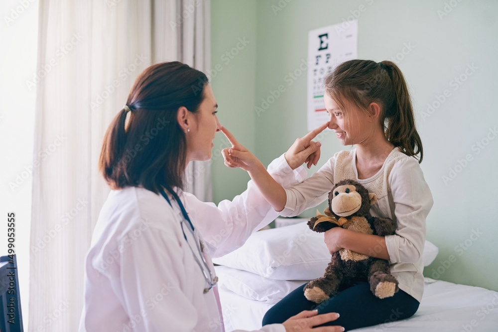 I see dozens of little patients but shes my favorite. Shot of a friendly doctor sitting in front of 