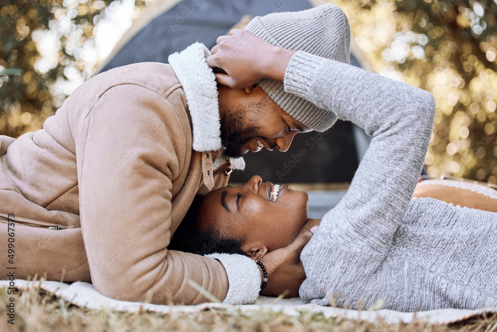 Now were both upside down. Shot of a young couple spending quality time together while camping.