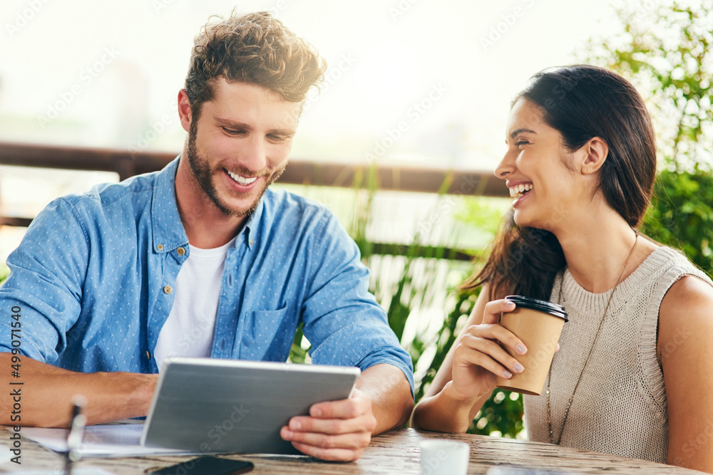 Online is the best place to source inspiration. Shot of two businesspeople using a digital tablet to