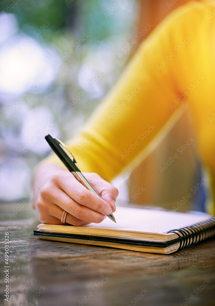 Write because your thoughts need a place to go. Cropped shot of a woman sitting at a table and writi