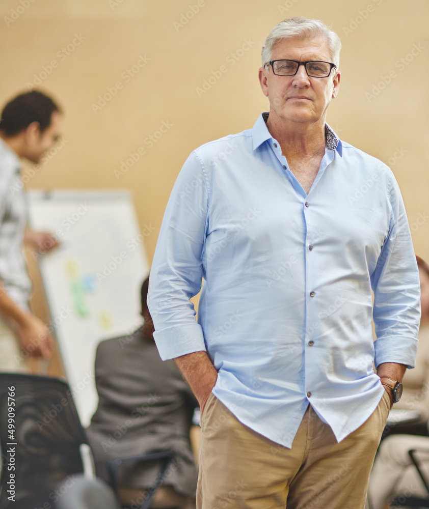 I trust my team. Cropped portrait of a handsome mature man standing with his hands in his pockets in