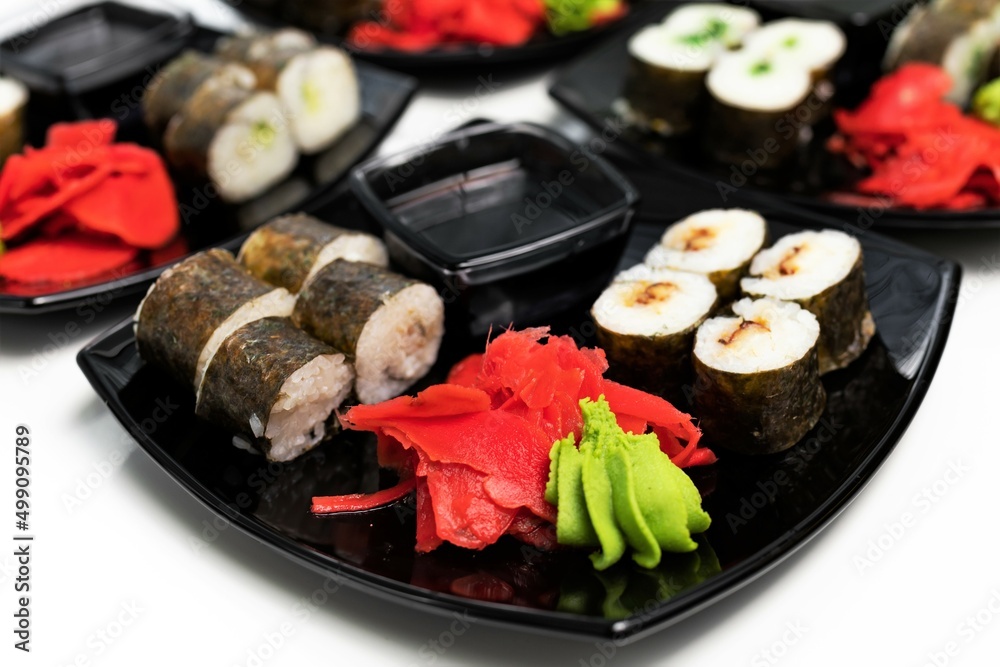 rolls, black plate, white background