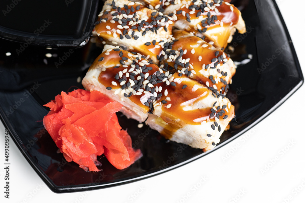 rolls, black plate, white background