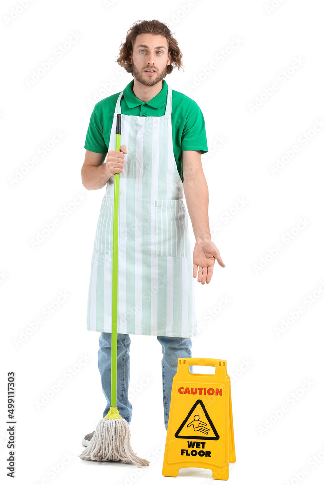 Young worker of cleaning service with mop and caution sign on white background