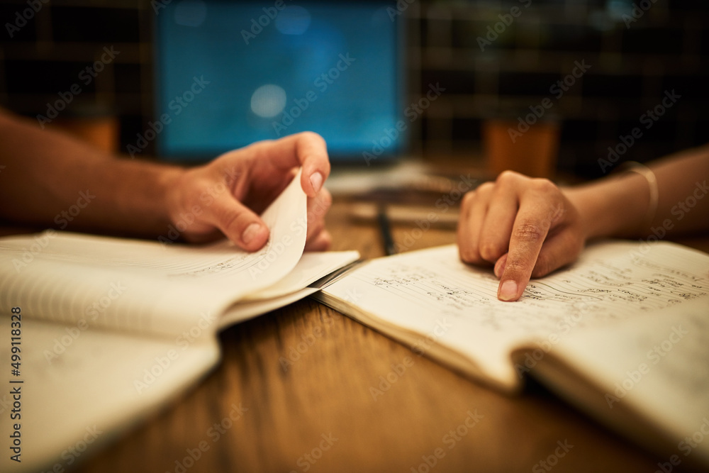 Eager students get the best results. Cropped shot of two unidentifiable students having a study sess