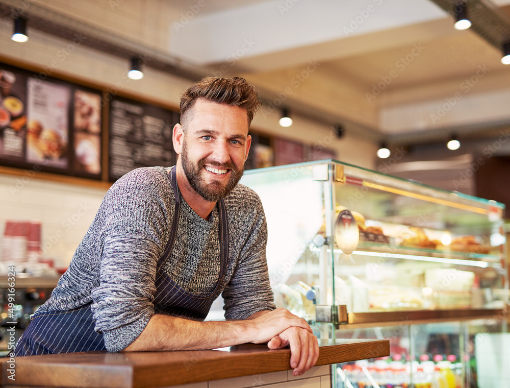 Its all about having the drive to succeed. Portrait of a proud business owner standing in his cafe.