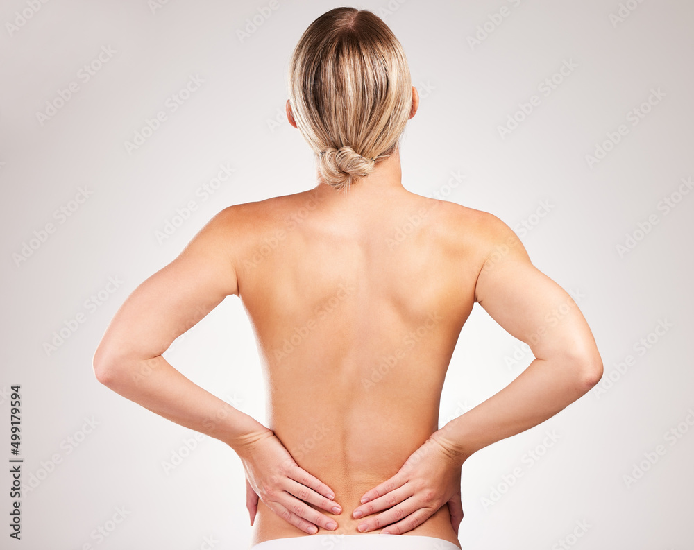 The perfect body takes work. Studio shot of an unrecognizable young woman posing with her back facin