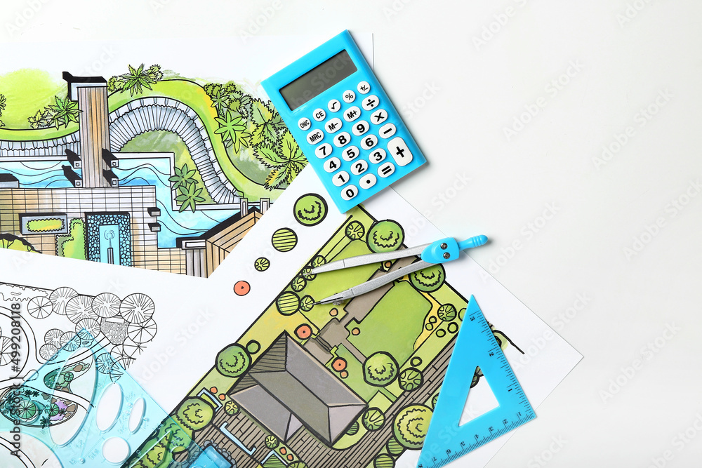 Landscape designers plans with stationery and calculator on white background