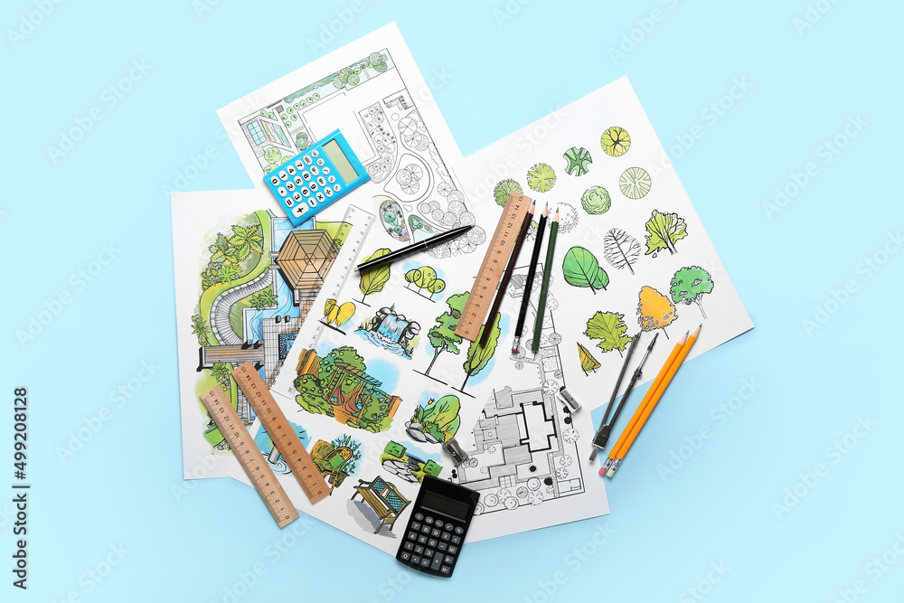 Paper sheets with sketches for landscape design and stationery on color background