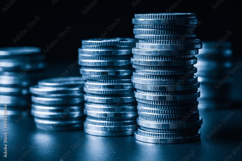 Pile of gold coins stack in finance treasury deposit bank account for saving . Concept of corporate 