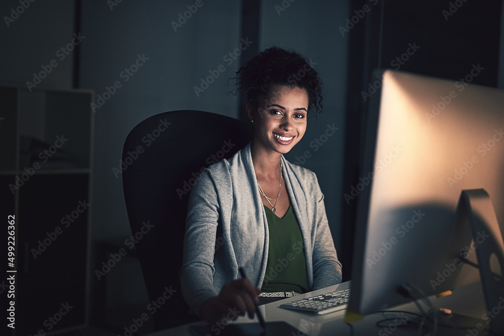 Great results require a dedicated amount of hours. Portrait of a young businesswoman working late on