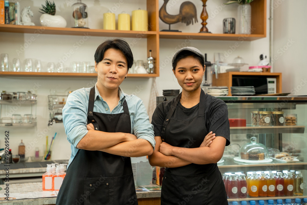 Asia Barista ready take order from customer in coffee shop,Service mind concept,Restaurant worker.