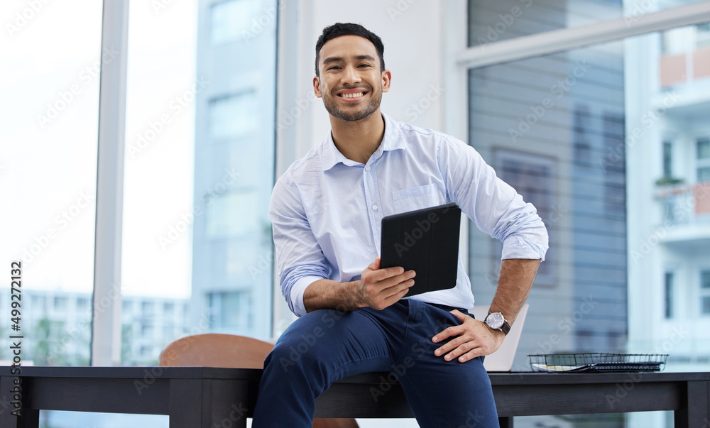 My name will be spoke in rooms globally. Shot of a handsome young businessman sitting alone in his o