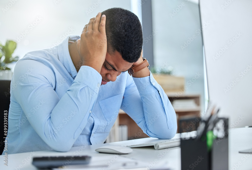 What dont they understand. Shot of a handsome young call centre agent sitting alone in the office an