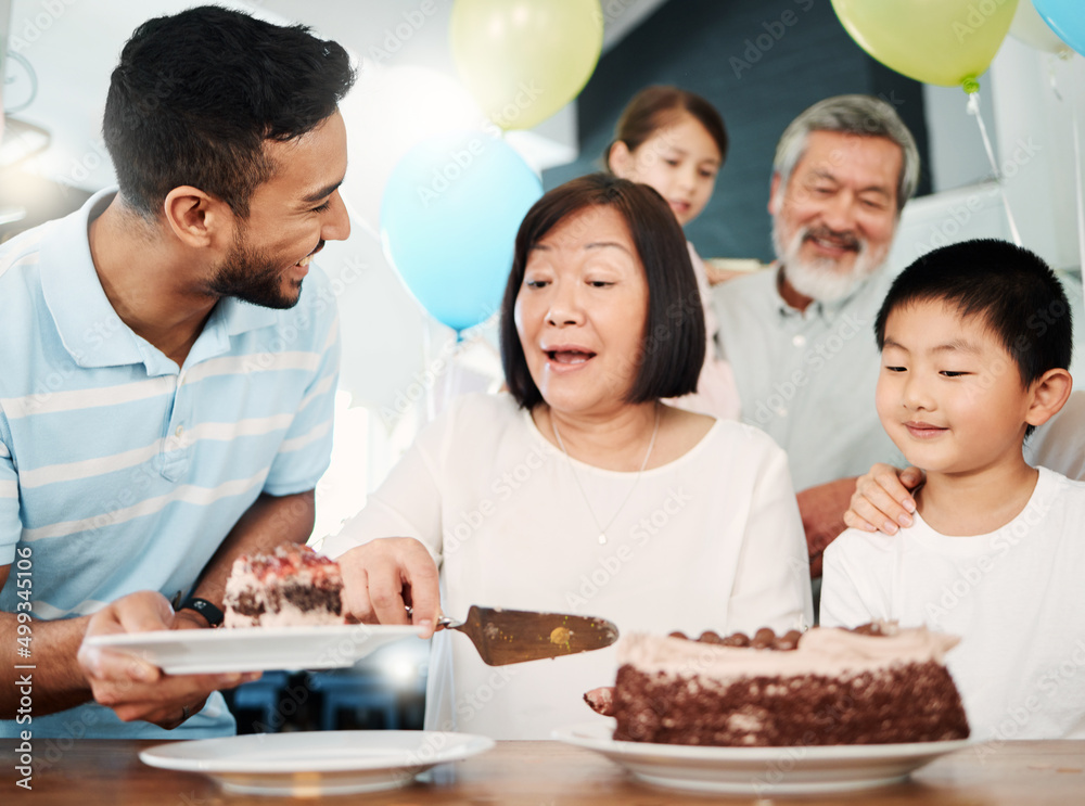 You are my kind of crazy. Shot of a happy family celebrating a birthday at home.