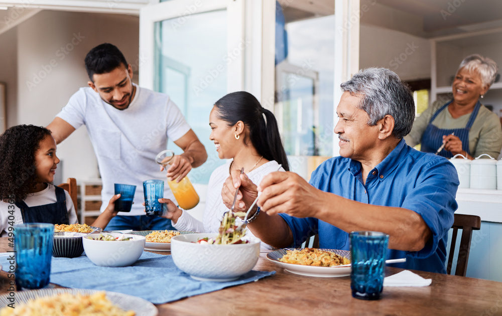 What did you put in these. Shot of a happy family having lunch together at home.