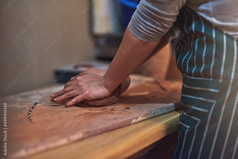 Mould your creativity. Closeup shot of a ceramic artist working on her pottery in a workshop.