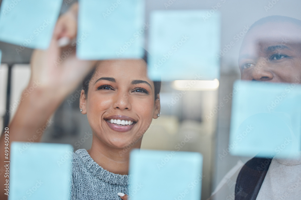 Hard work helps a business make progress with profits. Shot of two businesspeople brainstorming with