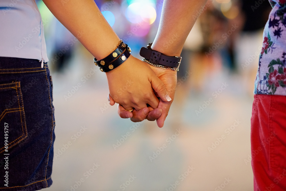 Ill always be by your side. Cropped shot of a couple holding hands while out in the city.