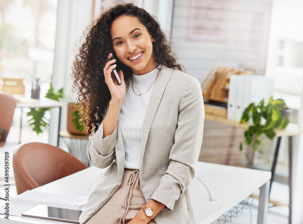 I always keep in touch with my network. Portrait of a young businesswoman talking on a cellphone in 