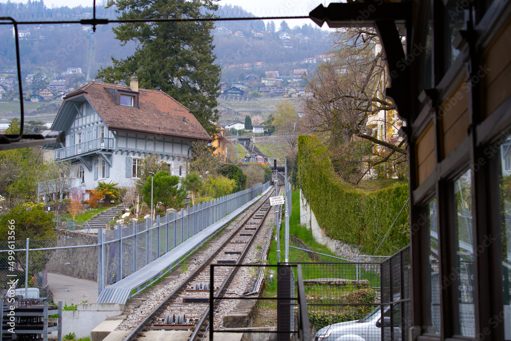 Route with railway tracks of Funicular Vevey-Mont-Pèlerin on a cloudy spring day. Photo taken April 