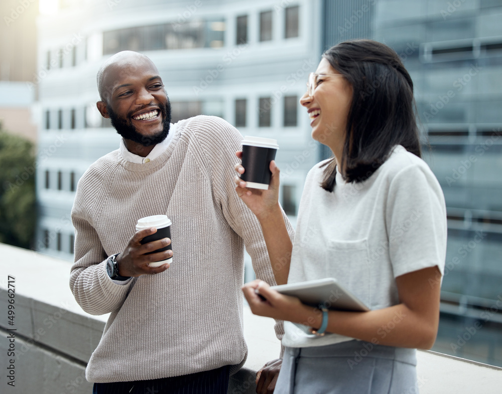 Business talk mixed with a little chit-chat. Shot of two businesspeople drinking coffee together out