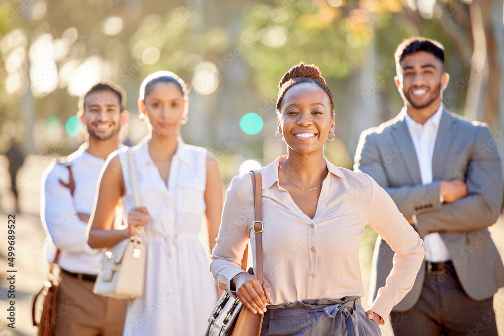 Work week is done, time for the weekend. Shot of a diverse group of businesspeople standing together