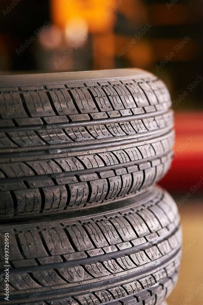 Spare wheels. Closeup shot of a pile of car tyres.