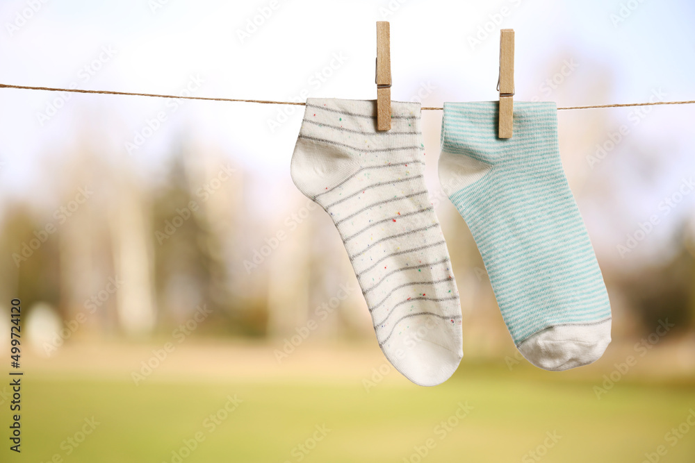 Drying of washed socks on rope outdoors