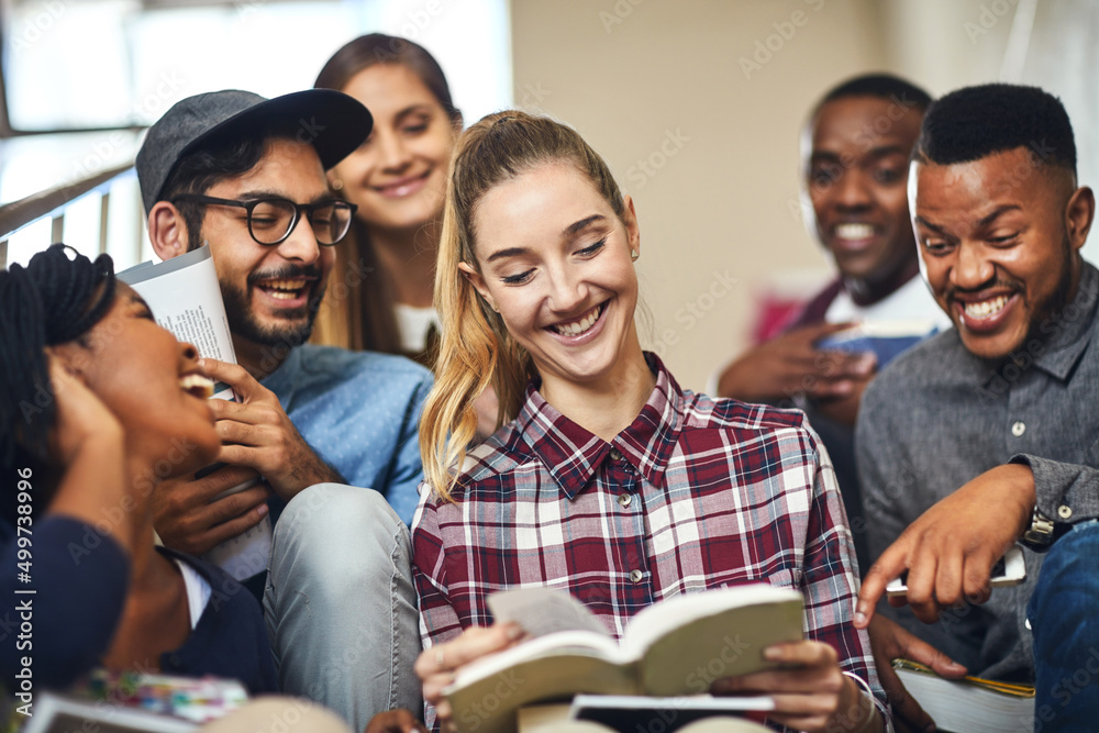 Adding a little fun to their study session. Cropped shot of a group of young university students stu