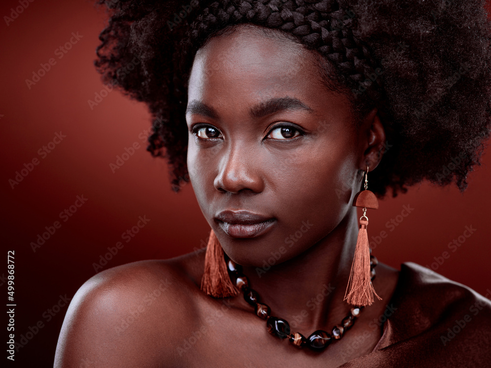 Be the woman you were made to be. Cropped portrait of a beautiful young woman posing against a red b