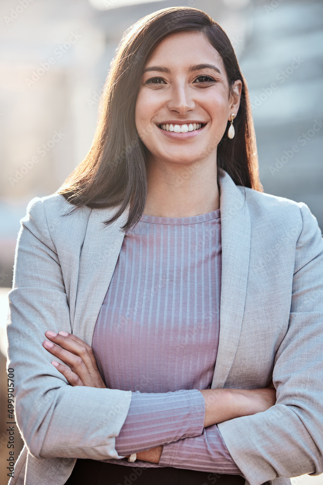 Im determined to be successful in this city. Shot of an attractive young businesswomen standing alon